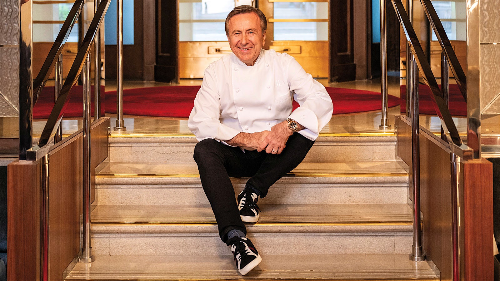 Chef Daniel Boulud on the steps of Restaurant Daniel